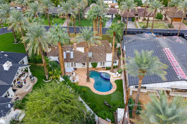 an aerial view of a house with outdoor space