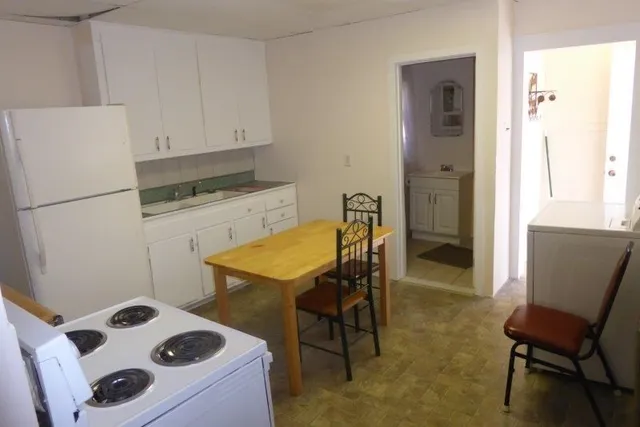 a en suite bathroom with a sink a toilet and mirror