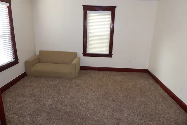 a living room with furniture window and outer view