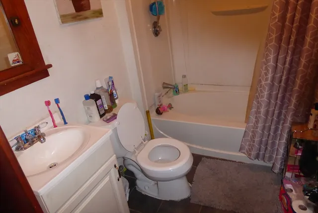 a kitchen with stainless steel appliances a stove and wooden floor