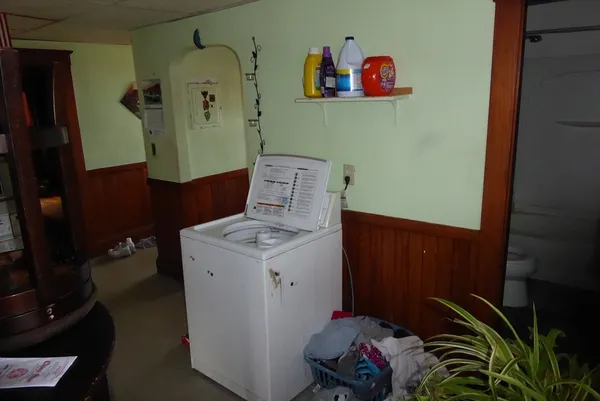 a living room with furniture fireplace and flat screen tv