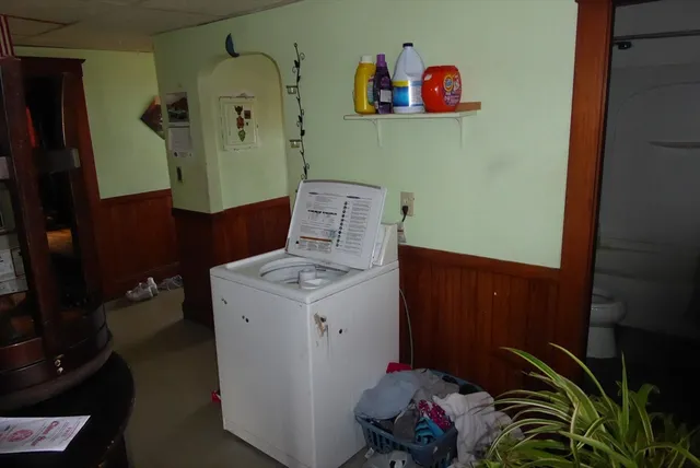 a living room with furniture fireplace and flat screen tv