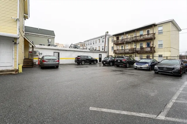a view of cars parked in front of a building