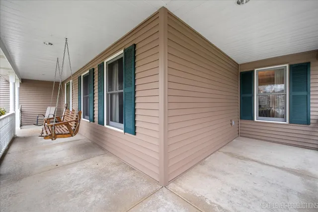 a view of a chairs with porch in the backyard