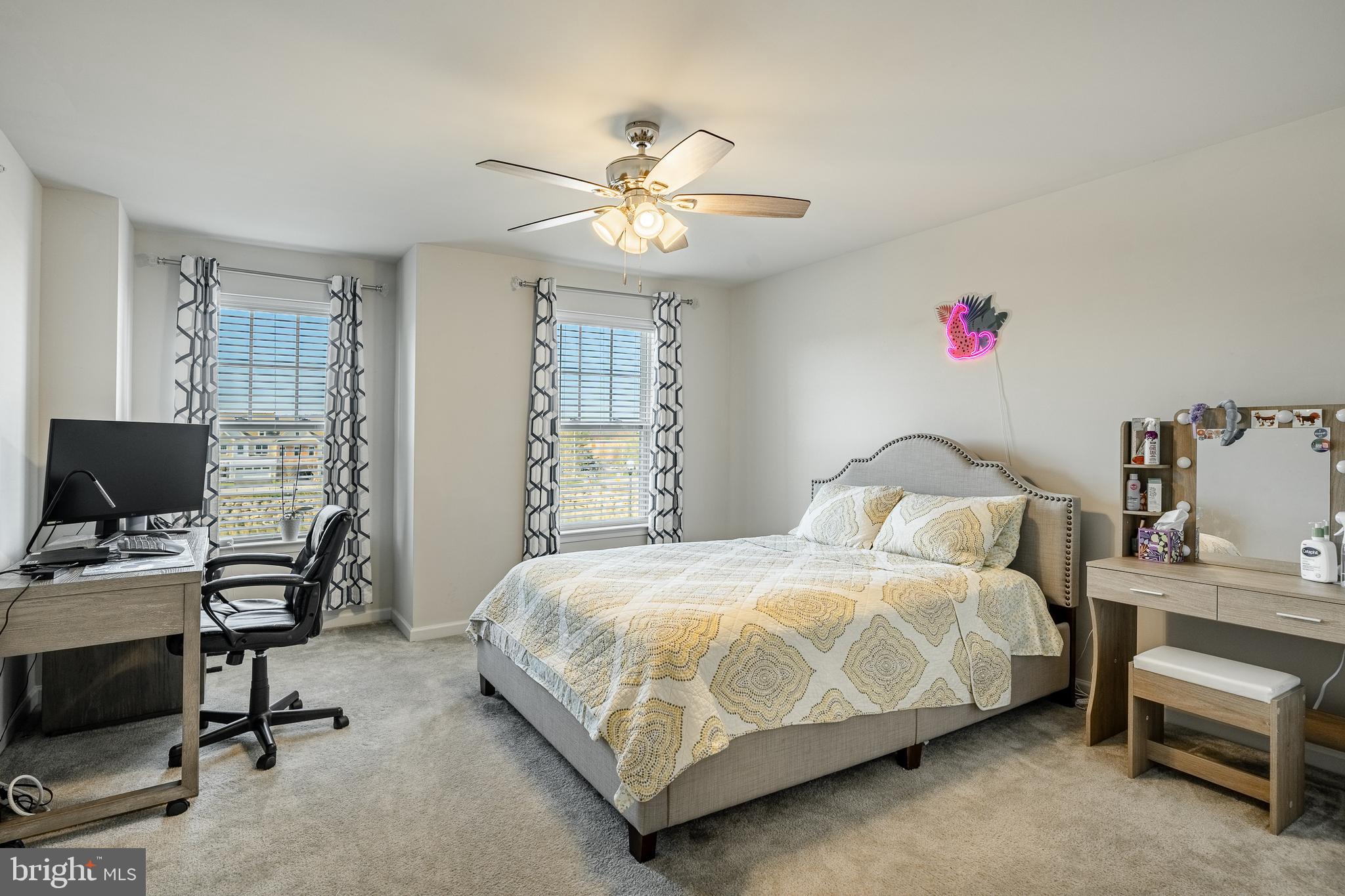 25 North Tompkins Square Downingtown, PA 19335 - Photo 16 of 53 a bedroom with a bed and a chandelier