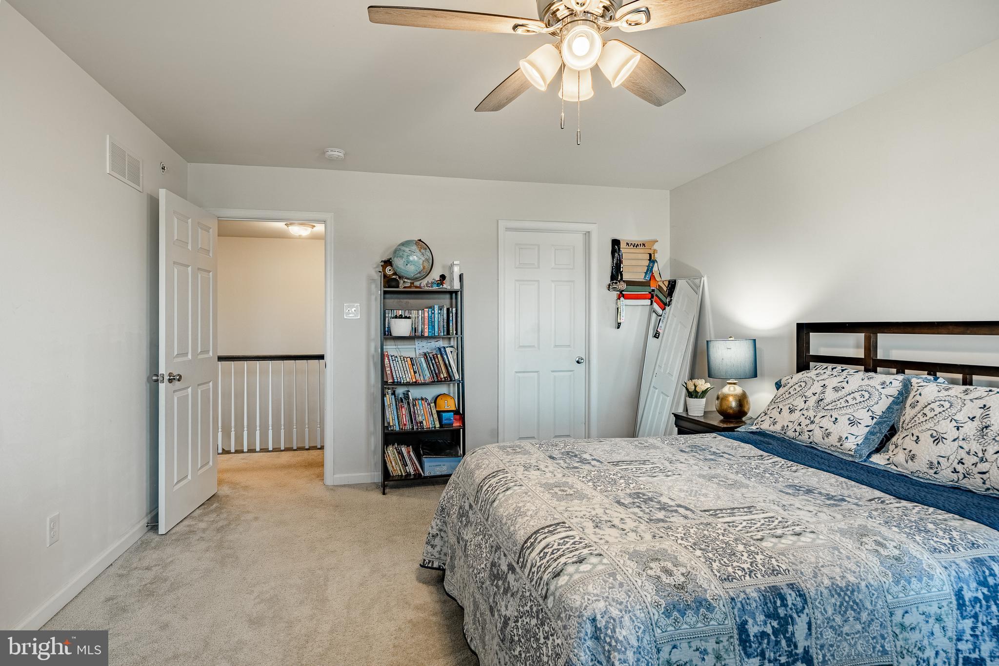 25 North Tompkins Square Downingtown, PA 19335 - Photo 20 of 53 a bedroom with a bed and a chandelier