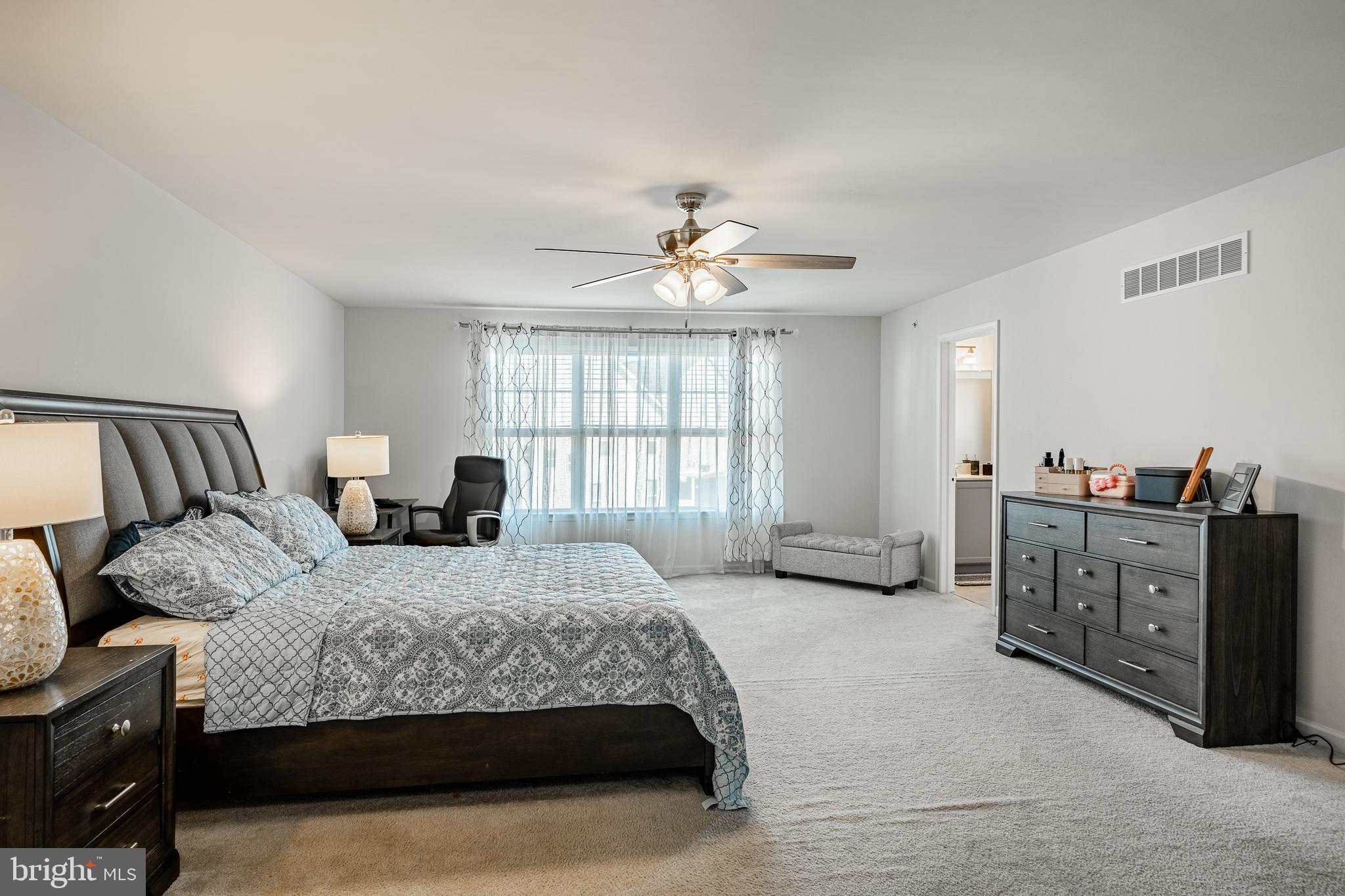 25 North Tompkins Square Downingtown, PA 19335 - Photo 23 of 53 a bedroom with a bed and a chandelier