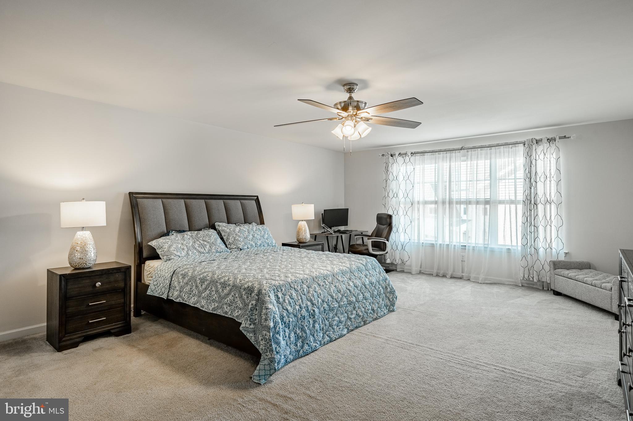 25 North Tompkins Square Downingtown, PA 19335 - Photo 24 of 53 a bedroom with a bed and a chandelier