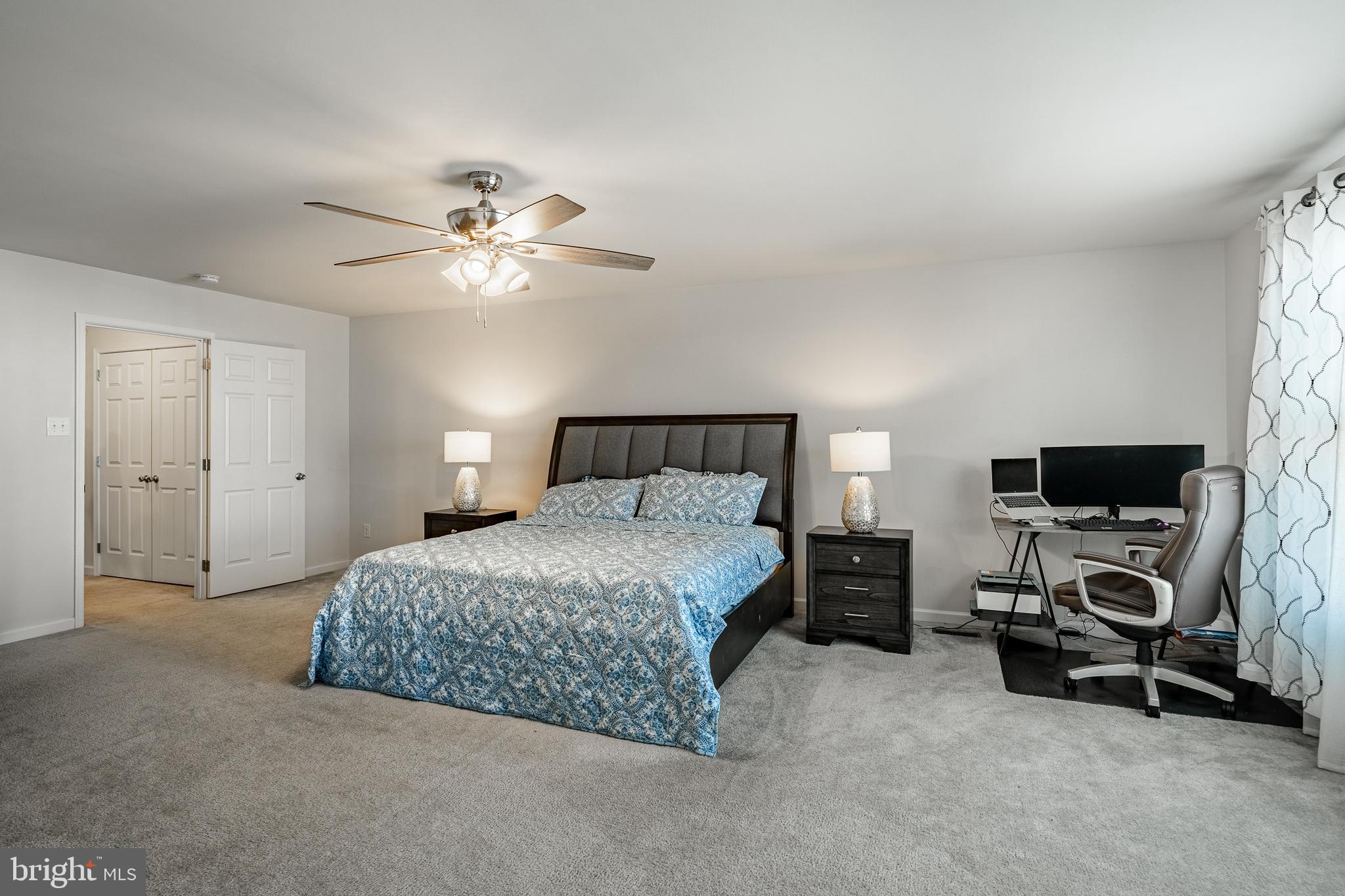 25 North Tompkins Square Downingtown, PA 19335 - Photo 25 of 53 a bedroom with a bed and a chandelier