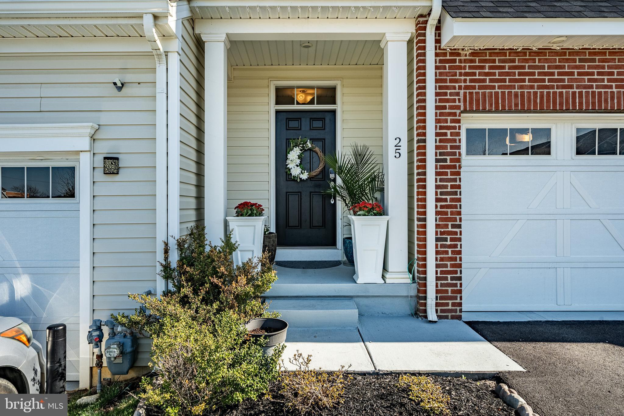 25 North Tompkins Square Downingtown, PA 19335 - Photo 4 of 53 a view of a entryway door front of house