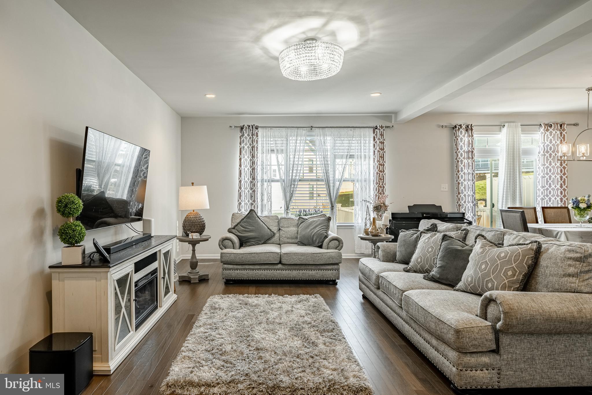 25 North Tompkins Square Downingtown, PA 19335 - Photo 5 of 53 a living room with furniture and a flat screen tv