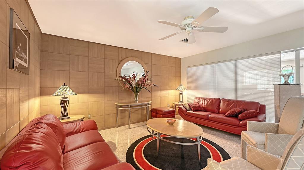 3012 Desoto Road Sarasota, FL 34234 - Photo 12 of 78 a living room with furniture and a chandelier