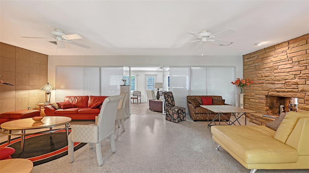 3012 Desoto Road Sarasota, FL 34234 - Photo 15 of 78 a living room with furniture a fireplace and a window