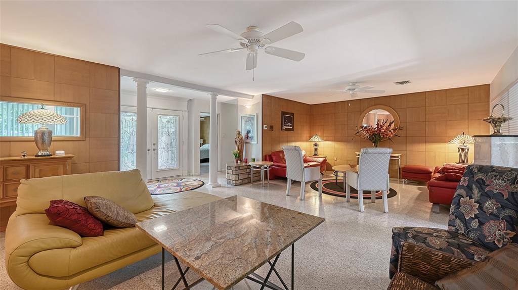 3012 Desoto Road Sarasota, FL 34234 - Photo 16 of 78 a living room with furniture and wooden floor