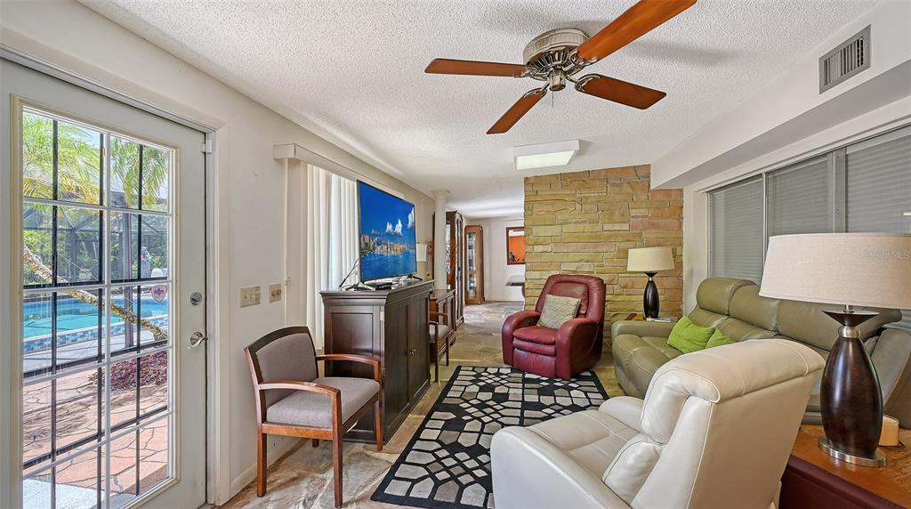 3012 Desoto Road Sarasota, FL 34234 - Photo 19 of 78 a living room with furniture and a fireplace