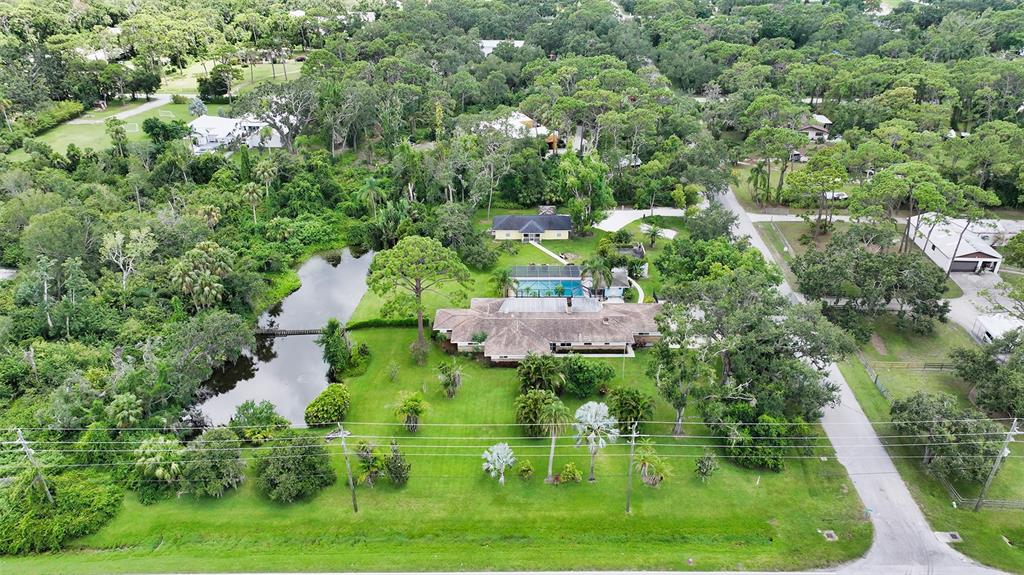 3012 Desoto Road Sarasota, FL 34234 - Photo 2 of 78 an aerial view of residential house with outdoor space and trees all around