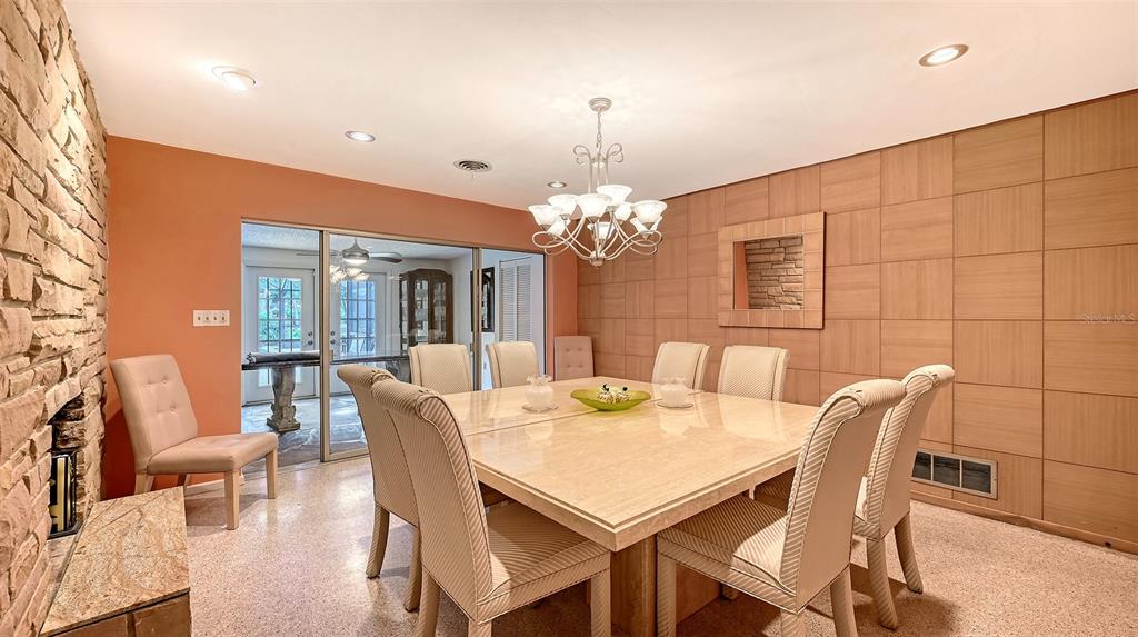 3012 Desoto Road Sarasota, FL 34234 - Photo 25 of 78 a view of a dining room with furniture and chandelier