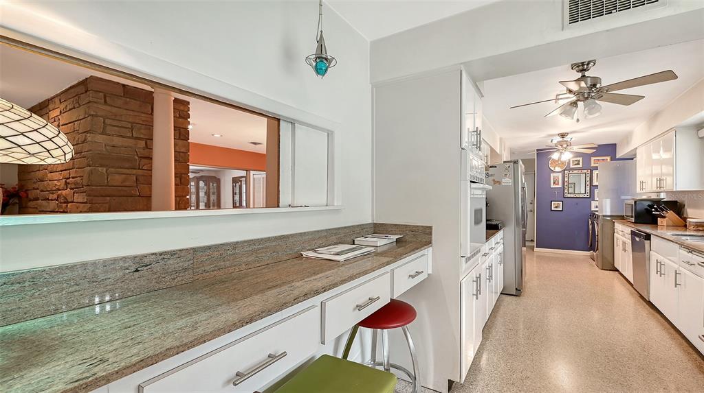 3012 Desoto Road Sarasota, FL 34234 - Photo 28 of 78 a kitchen with stainless steel appliances granite countertop a stove a sink and a refrigerator