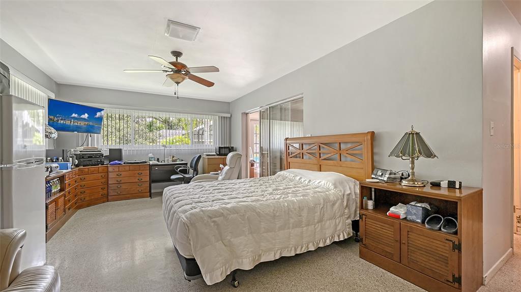 3012 Desoto Road Sarasota, FL 34234 - Photo 35 of 78 a bedroom with a bed and wooden floor