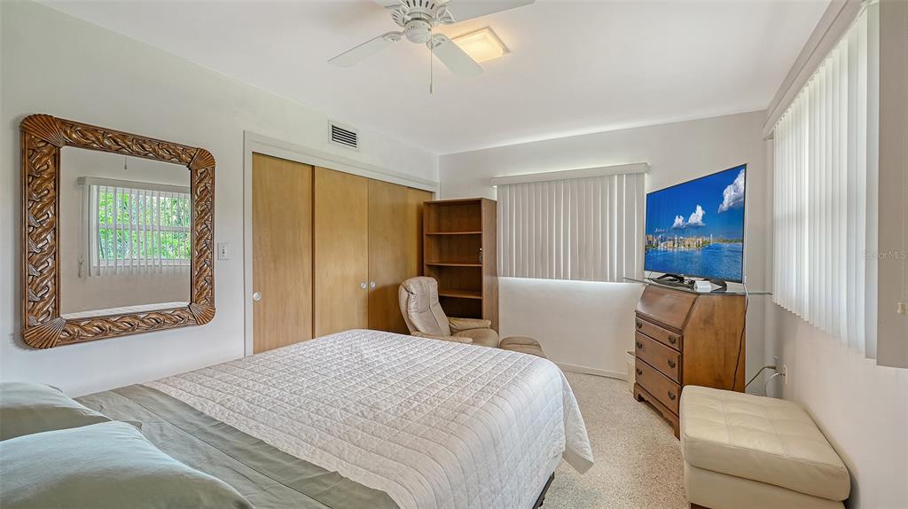 3012 Desoto Road Sarasota, FL 34234 - Photo 43 of 78 a bedroom with a bed and a couch