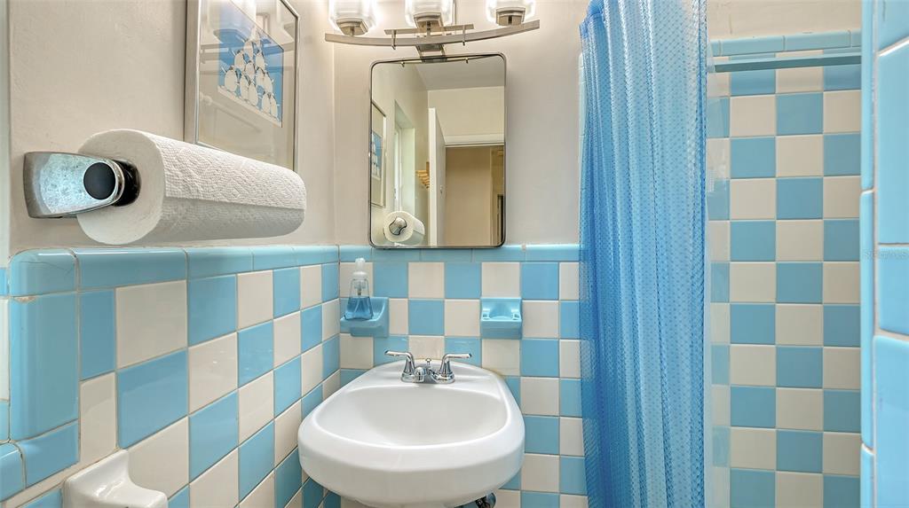 3012 Desoto Road Sarasota, FL 34234 - Photo 47 of 78 a bathroom with a sink a toilet and mirror