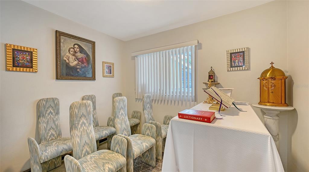 3012 Desoto Road Sarasota, FL 34234 - Photo 48 of 78 a living room with furniture a window and white walls