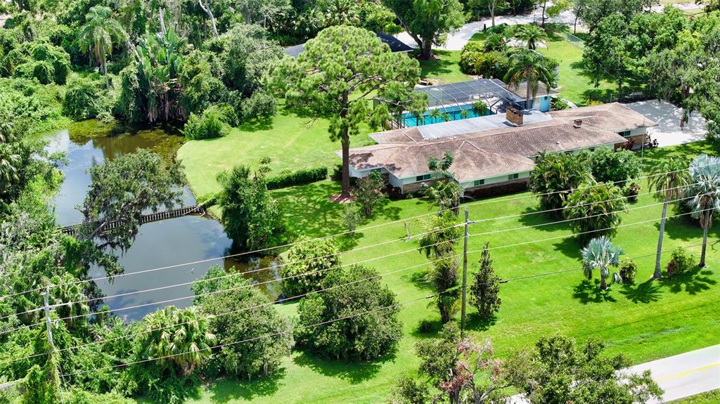 3012 Desoto Road Sarasota, FL 34234 - Photo 5 of 78 an aerial view of a house with a yard and outdoor seating