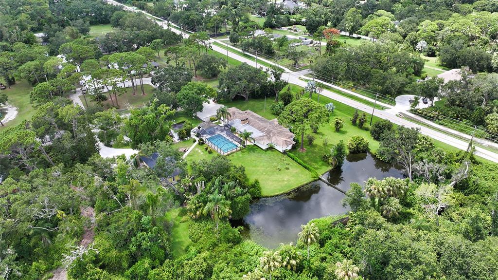 3012 Desoto Road Sarasota, FL 34234 - Photo 78 of 78 an aerial view of residential house with outdoor space and trees all around