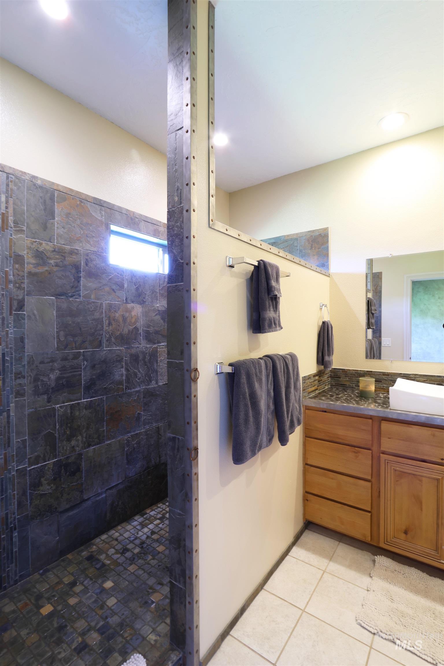 2278 Golf Lane Council, ID 83612 - Photo 14 of 31 Spacious shower with slate-style tile walls and mosaic tile flooring