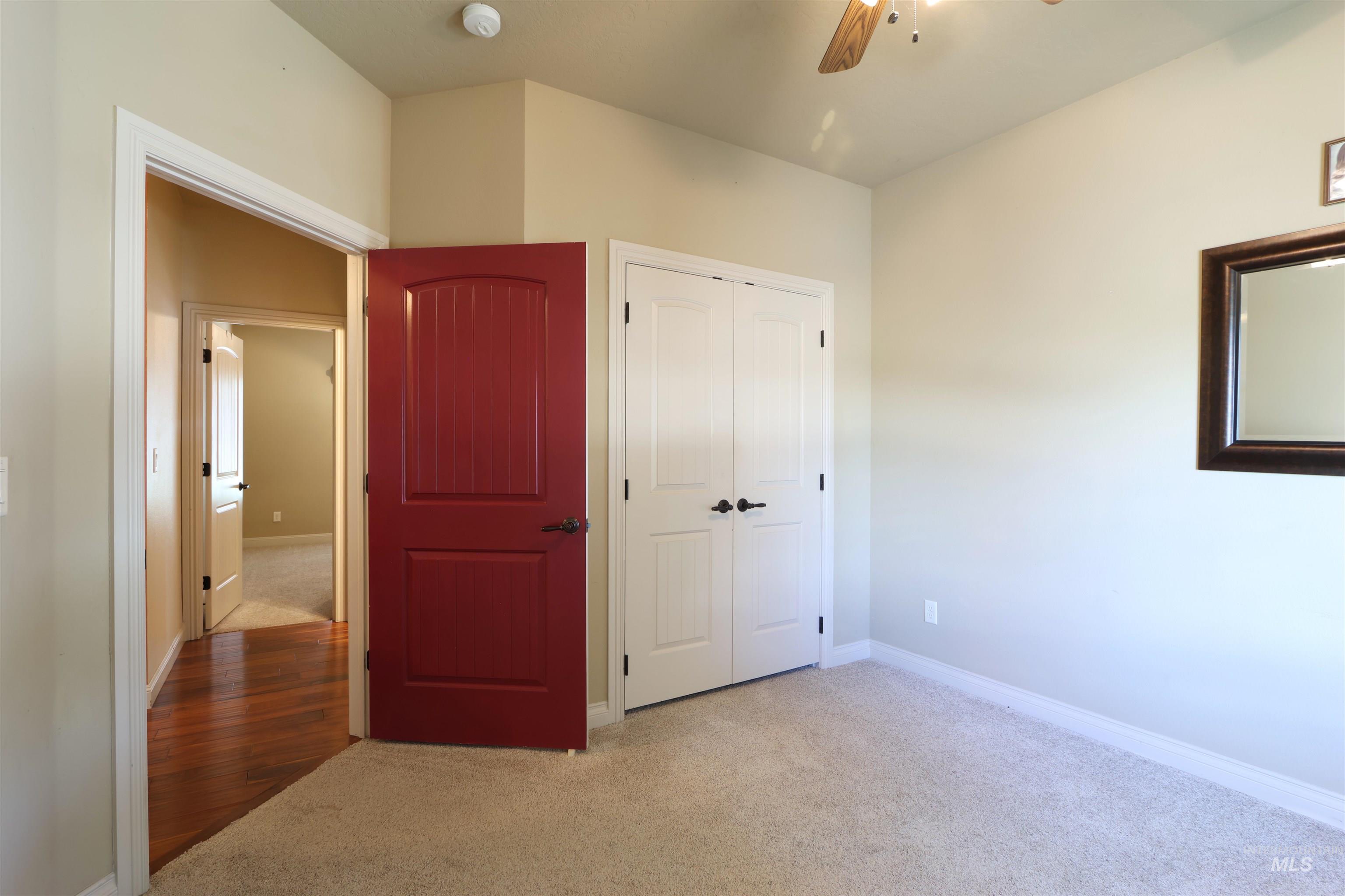 2278 Golf Lane Council, ID 83612 - Photo 16 of 31 Neutral wall paint complemented by white trim and light carpet flooring