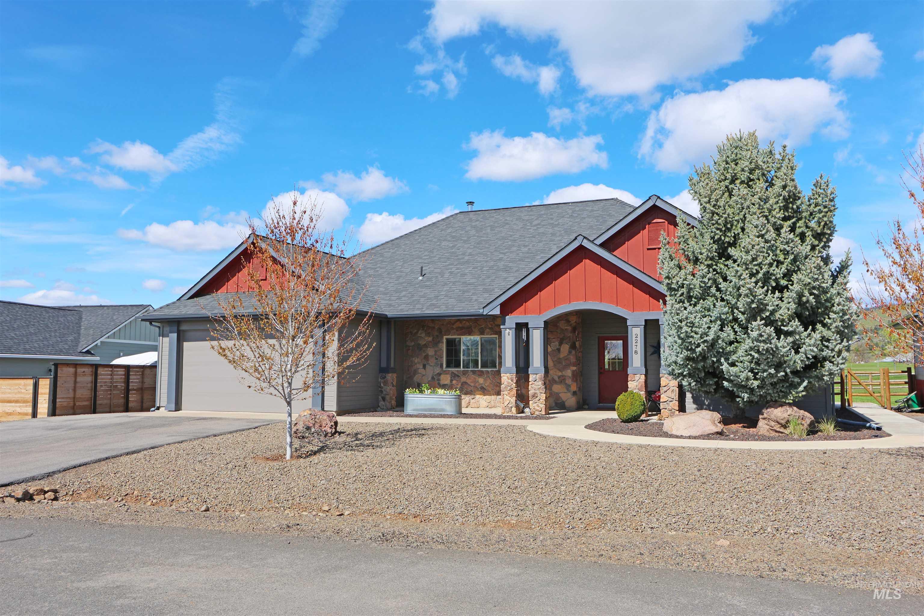 2278 Golf Lane Council, ID 83612 - Photo 2 of 31 Contemporary ranch-style residence featuring a stone facade and red siding accents