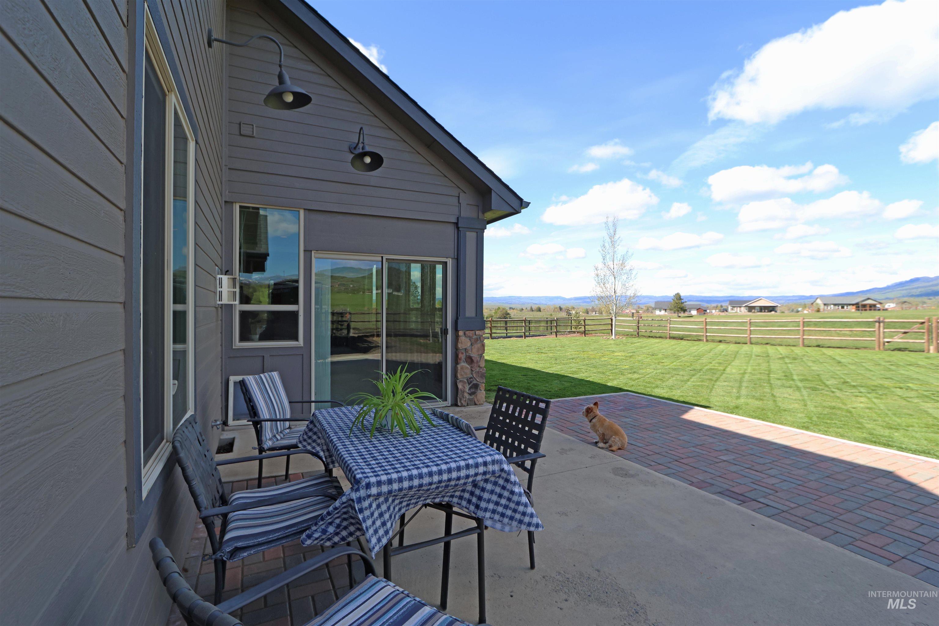 2278 Golf Lane Council, ID 83612 - Photo 24 of 31 Outdoor patio featuring a concrete slab and a paver stone extension