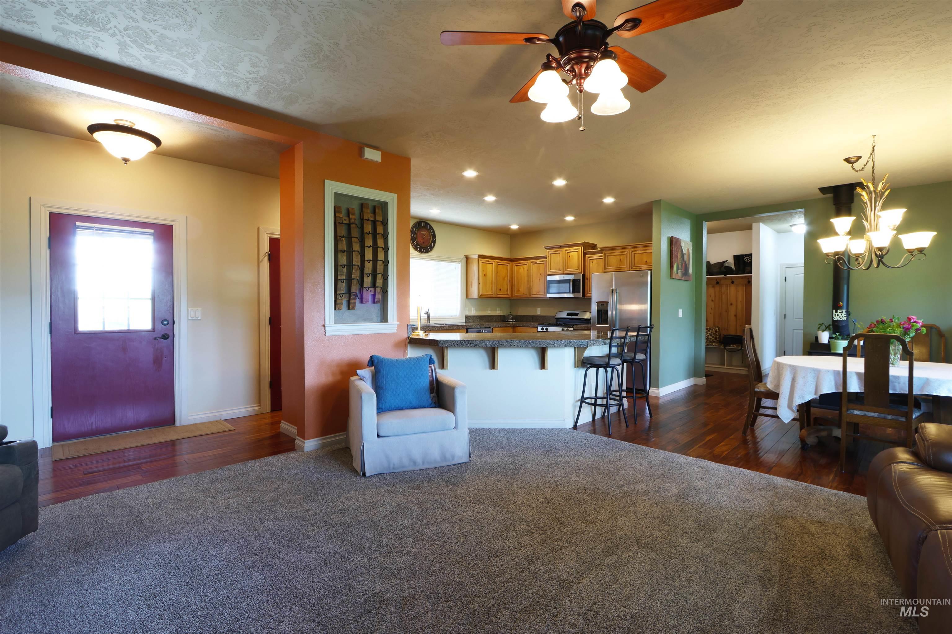 2278 Golf Lane Council, ID 83612 - Photo 4 of 31 Open concept living area featuring wood-finish flooring, recessed lighting, and a ceiling fan with integrated lighting