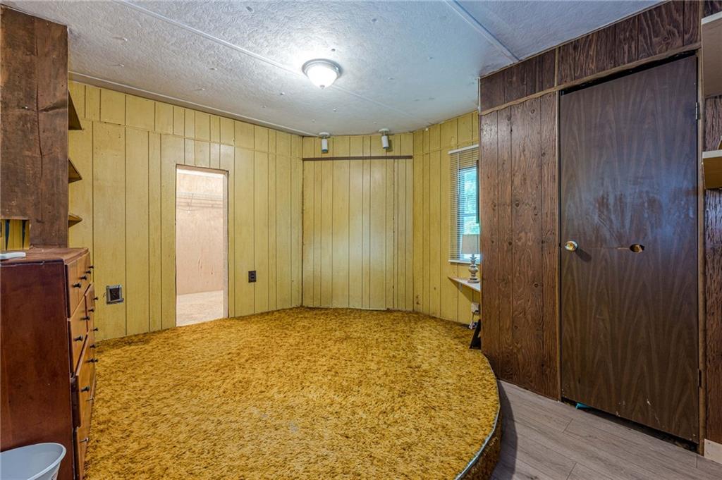 90 Valley Trail Southeast Acworth, GA 30101 - Photo 16 of 28 a view of a big room with wooden floor and windows
