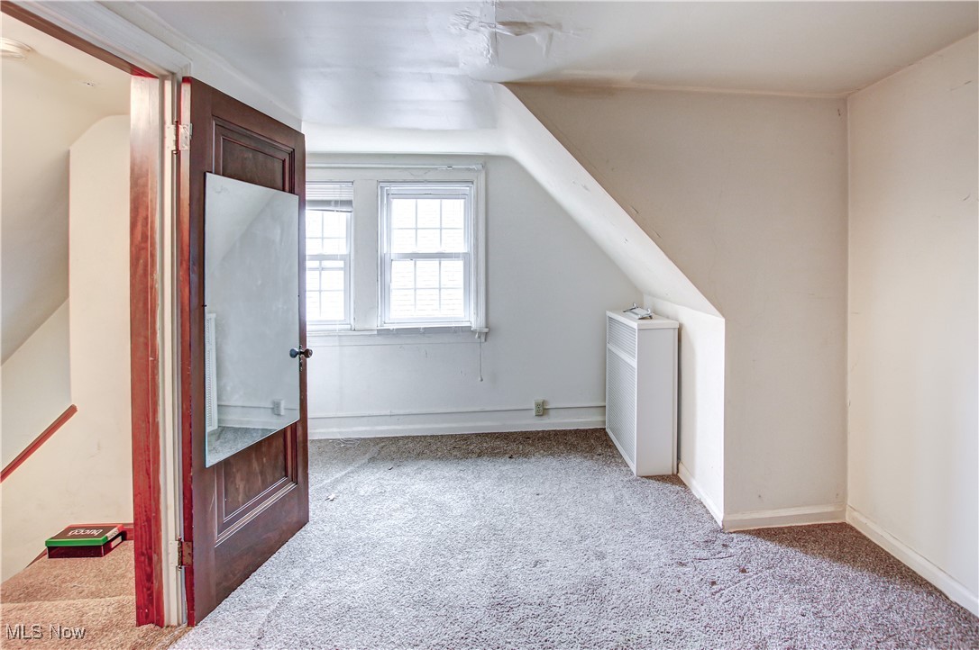 17800 Winslow Road Beachwood, OH 44122 - Photo 31 of 31 Bonus room with light carpet and lofted ceiling