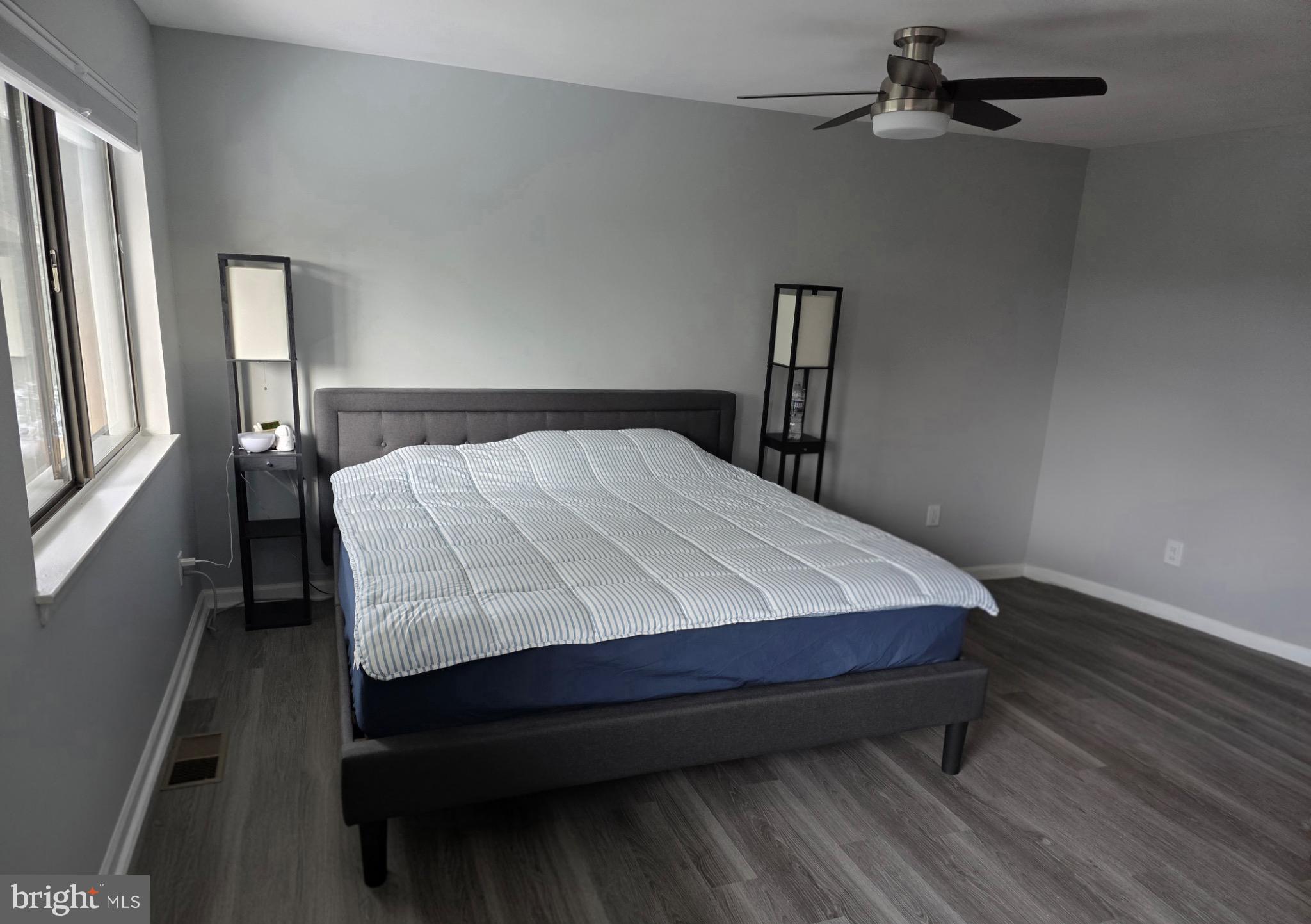 18420 Point Seneca Place, Unit BEDROOM 2 Germantown, MD 20874 - Photo 4 of 9 Serene primary bedroom with modern elegance.