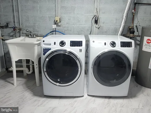 a utility room with dryer and washer