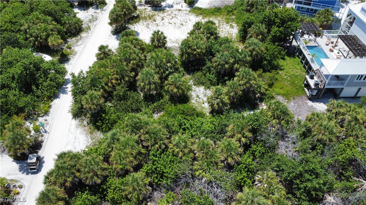4490 Conch Shell Drive Captiva, FL 33924 - Photo 15 of 32 an aerial view of a house with yard and outdoor seating