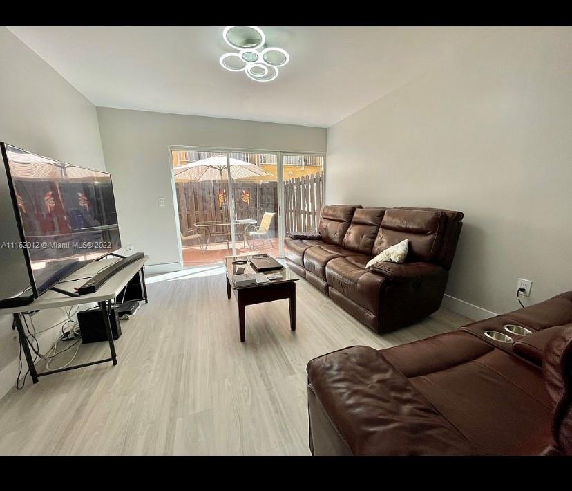 Kendale Lakes Miami, FL 33183 - Photo 4 of 9 a living room with furniture and a window