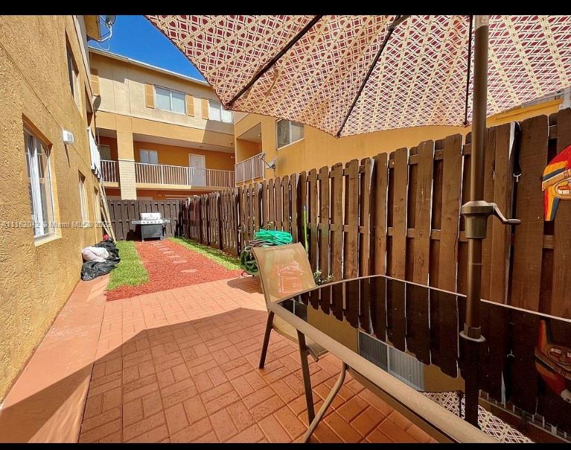 Kendale Lakes Miami, FL 33183 - Photo 5 of 9 a view of a chairs and table in the patio