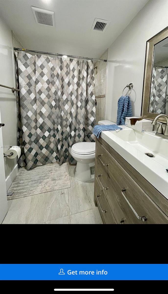 Kendale Lakes Miami, FL 33183 - Photo 6 of 9 a view of bathroom with a sink and a mirror