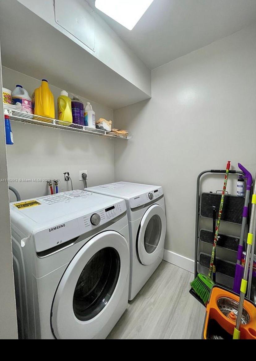 Kendale Lakes Miami, FL 33183 - Photo 7 of 9 a utility room with dryer and washer