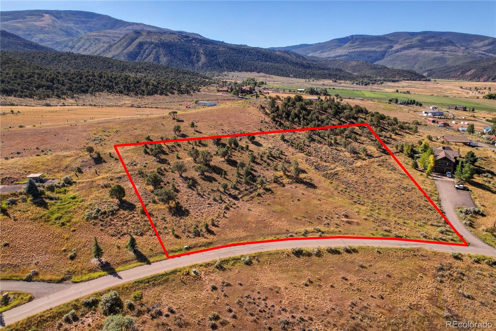 357 Amherst Road Gypsum, CO 81637 - Photo 14 of 15 a view of a field with a mountain in the background