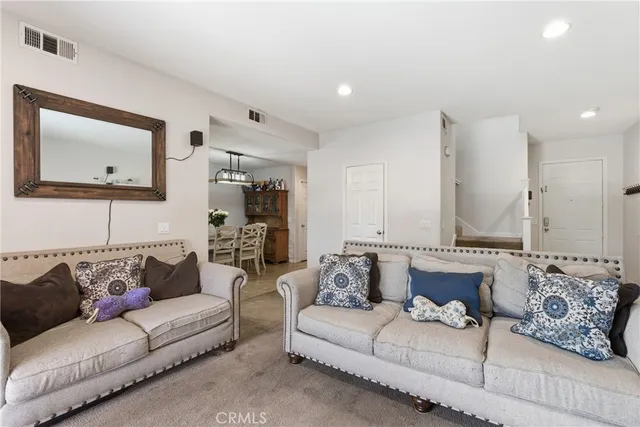 a living room with furniture and a couch