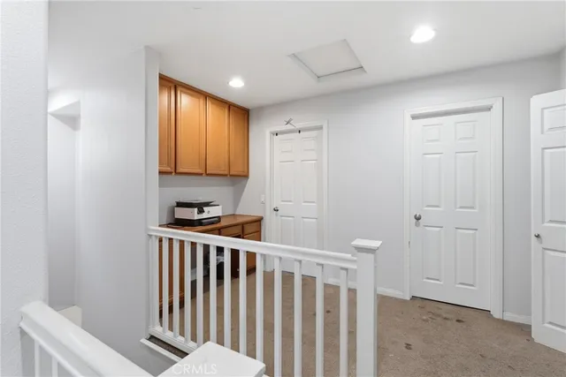 a view of a hallway with workspace