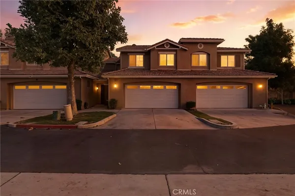 a front view of a house with yard