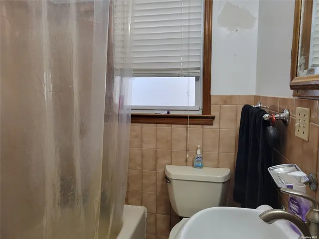 a bathroom with a toilet and a sink
