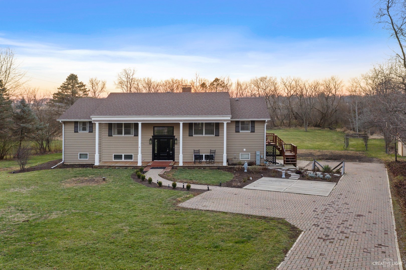 4S064 Thornapple Tree Road Sugar Grove, IL 60554 - Photo 2 of 39 front view of a house with a garden and patio