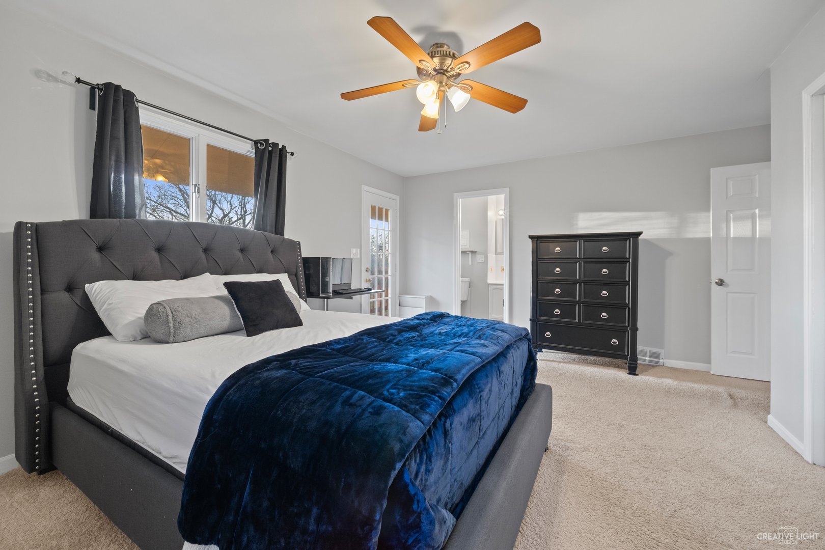 4S064 Thornapple Tree Road Sugar Grove, IL 60554 - Photo 19 of 39 a bedroom with a bed and a chandelier