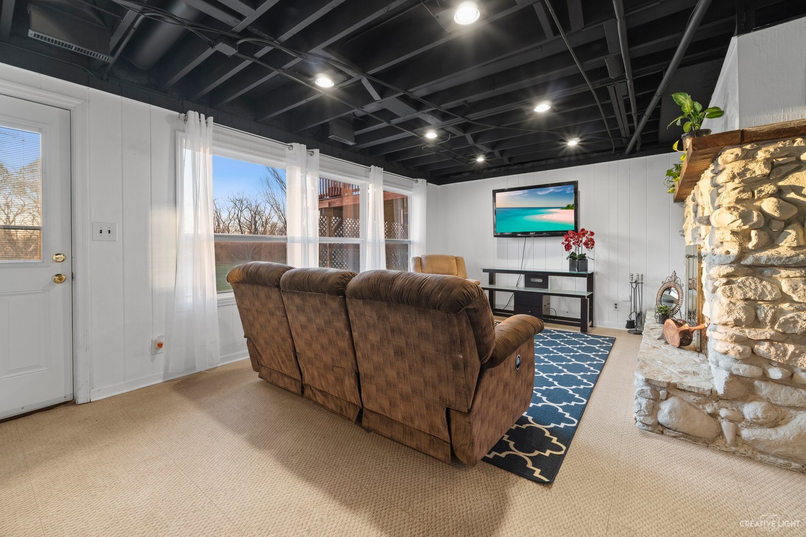 4S064 Thornapple Tree Road Sugar Grove, IL 60554 - Photo 22 of 39 a living room with furniture and a flat screen tv